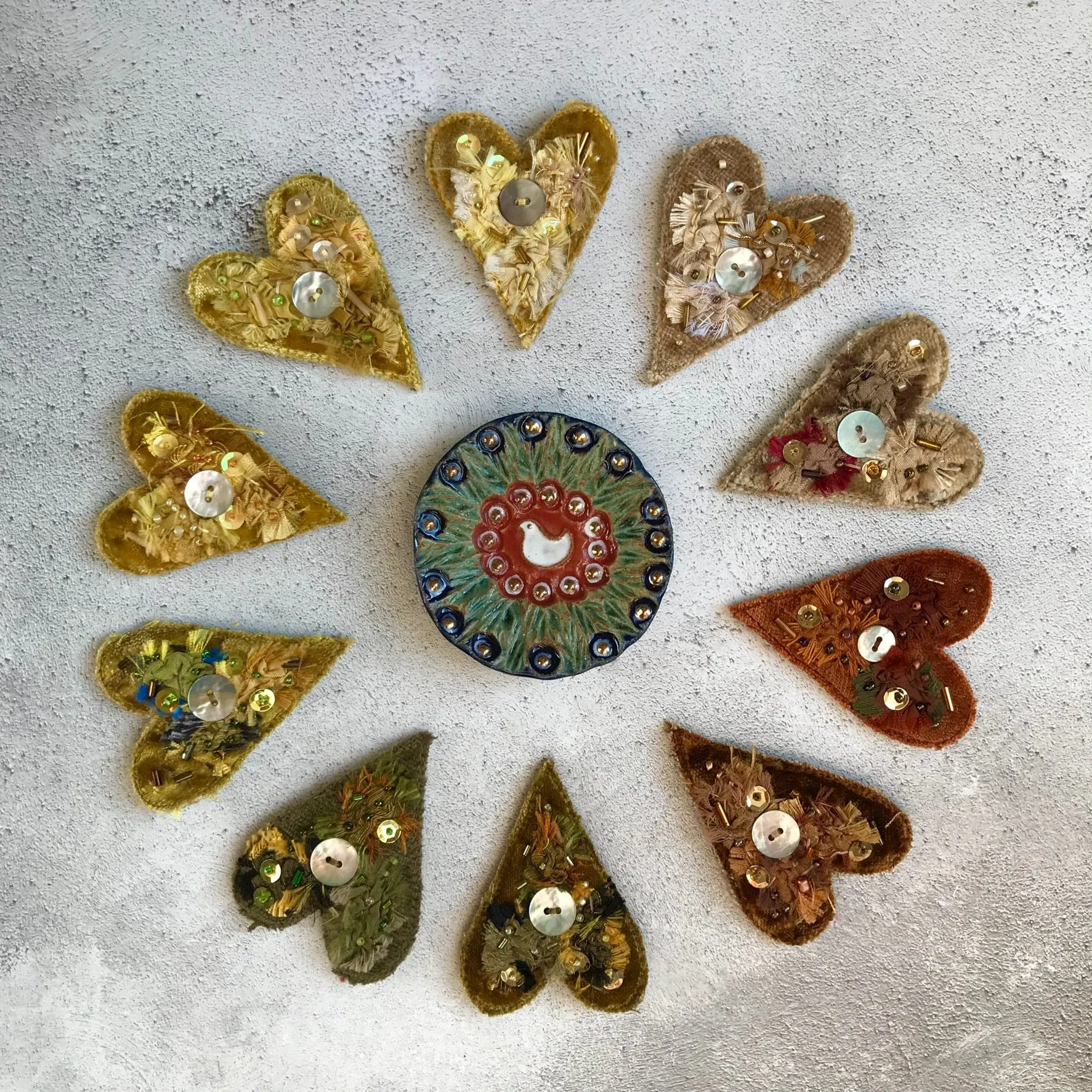 Fabric heart brooches in neutrals
